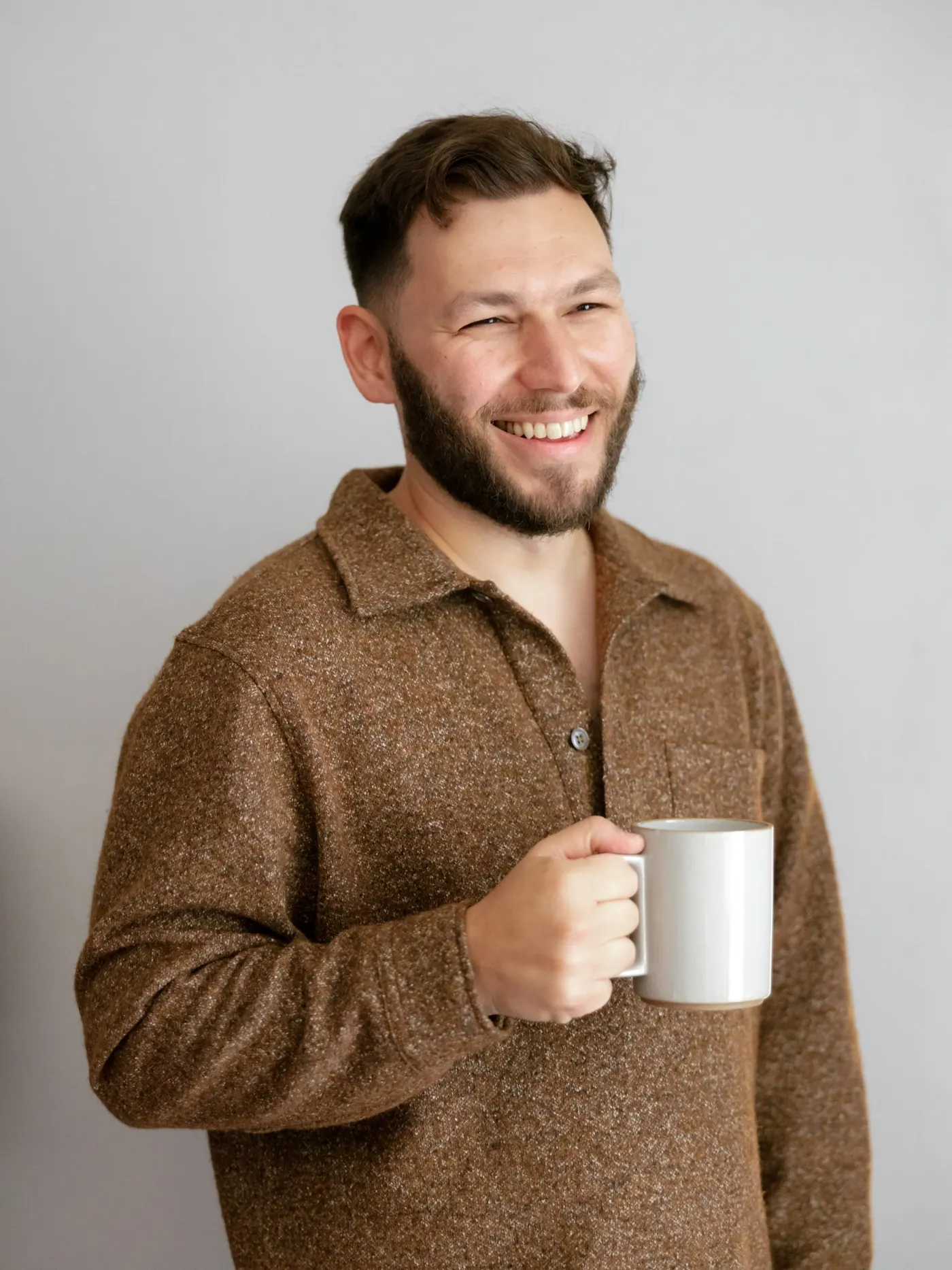 Michael Robin holding a coffee mug